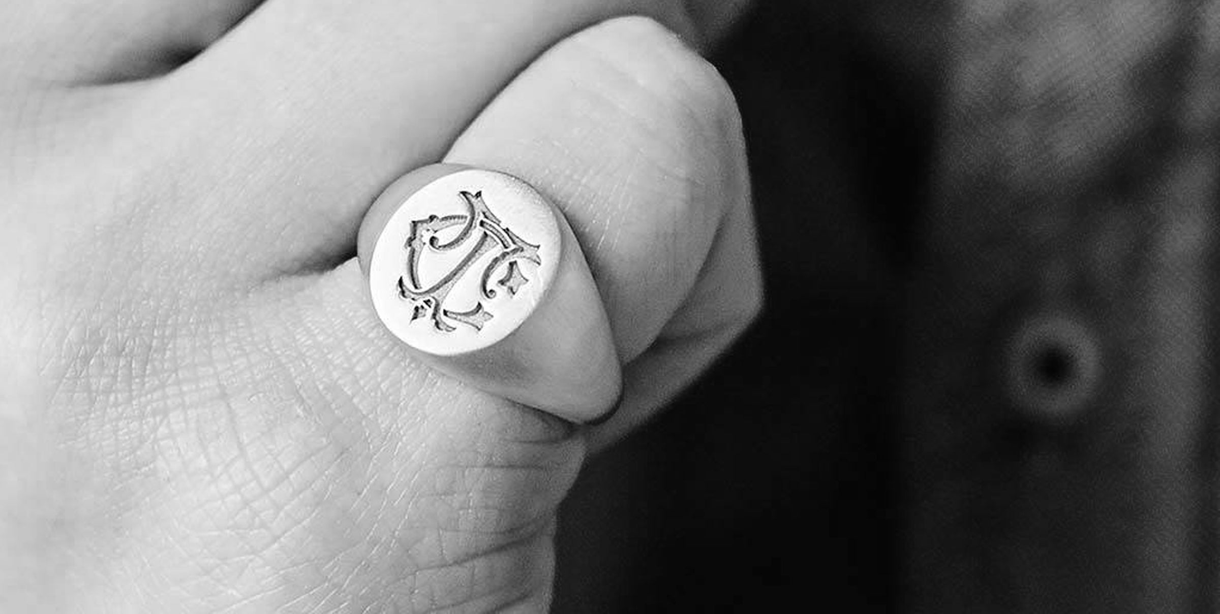 A sterling silver, heavyweight signet ring deeply engraved with a monogram using the initials TC