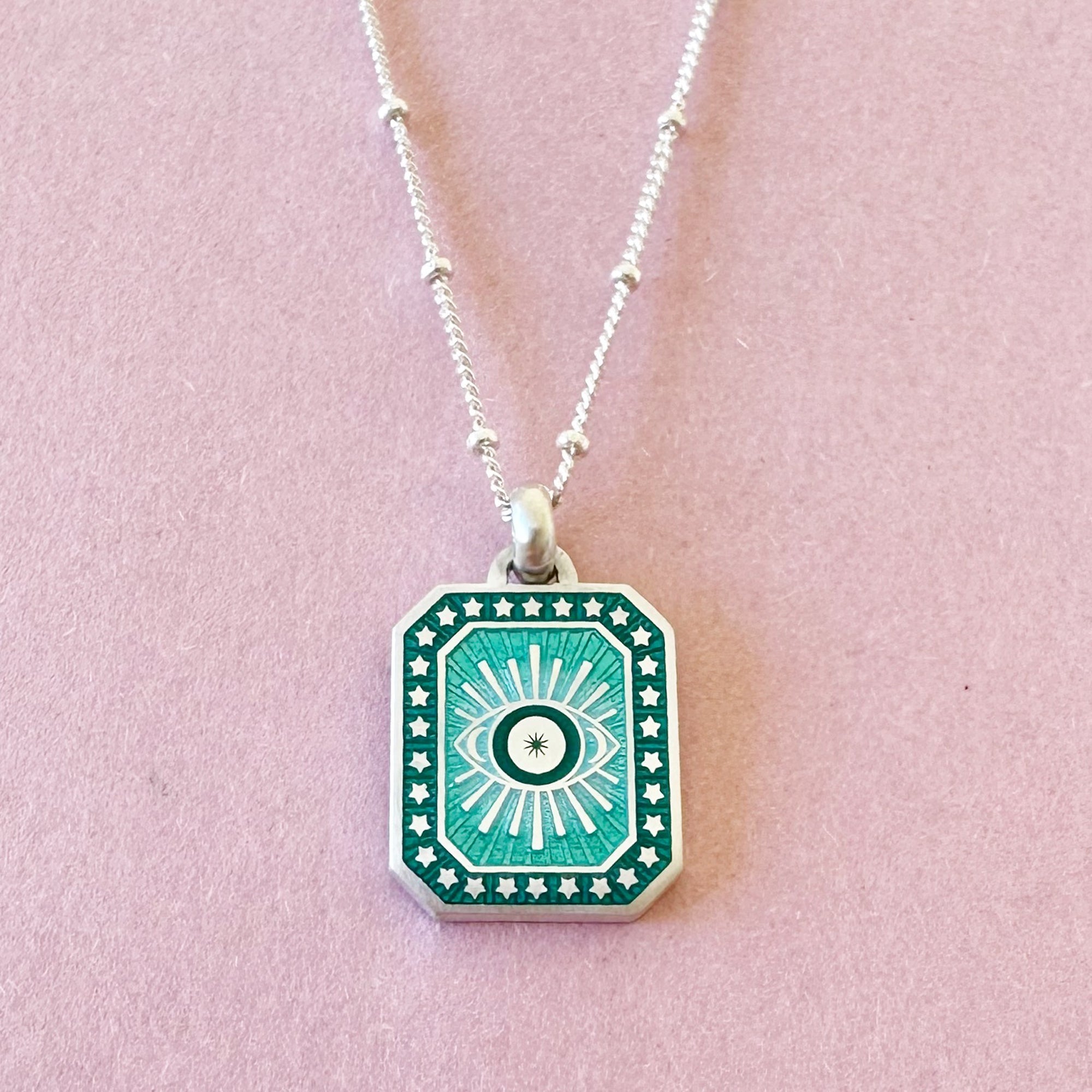 Vitreous Enamel Evil Eye Necklace by Sally Clay Jewellery hanging
