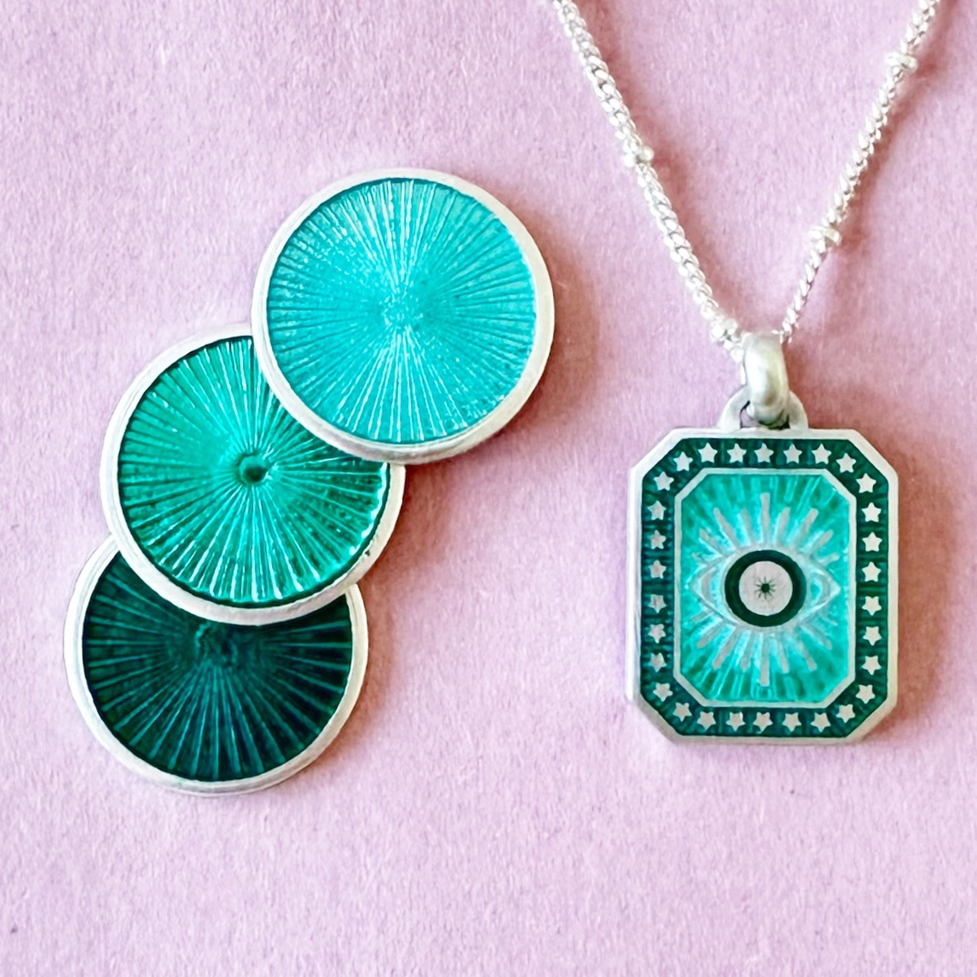 Vitreous Enamel Evil Eye Necklace by Sally Clay Jewellery hanging with enamel samples