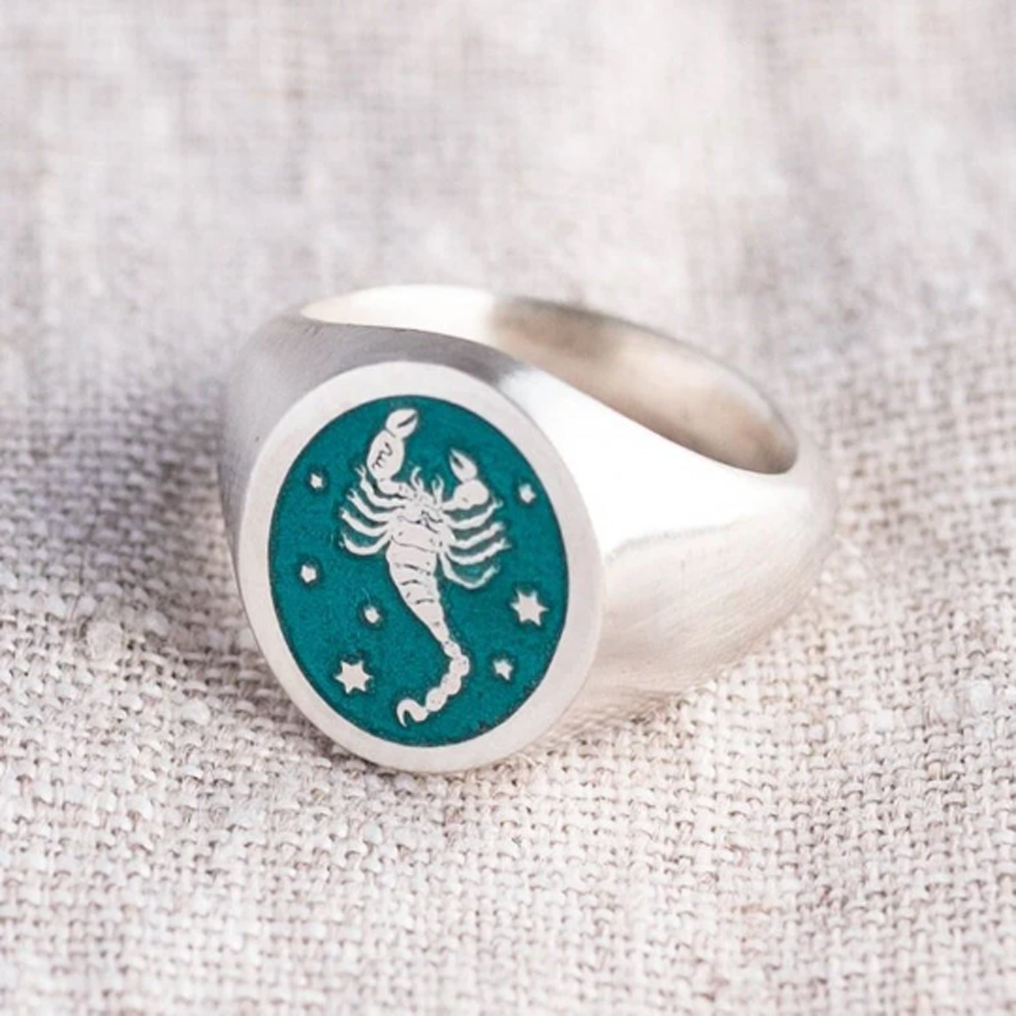 Sterling silver signet ring engraved with a detailed zodiac symbol (star sign) and hand enamelled with glass (vitreous) enamel