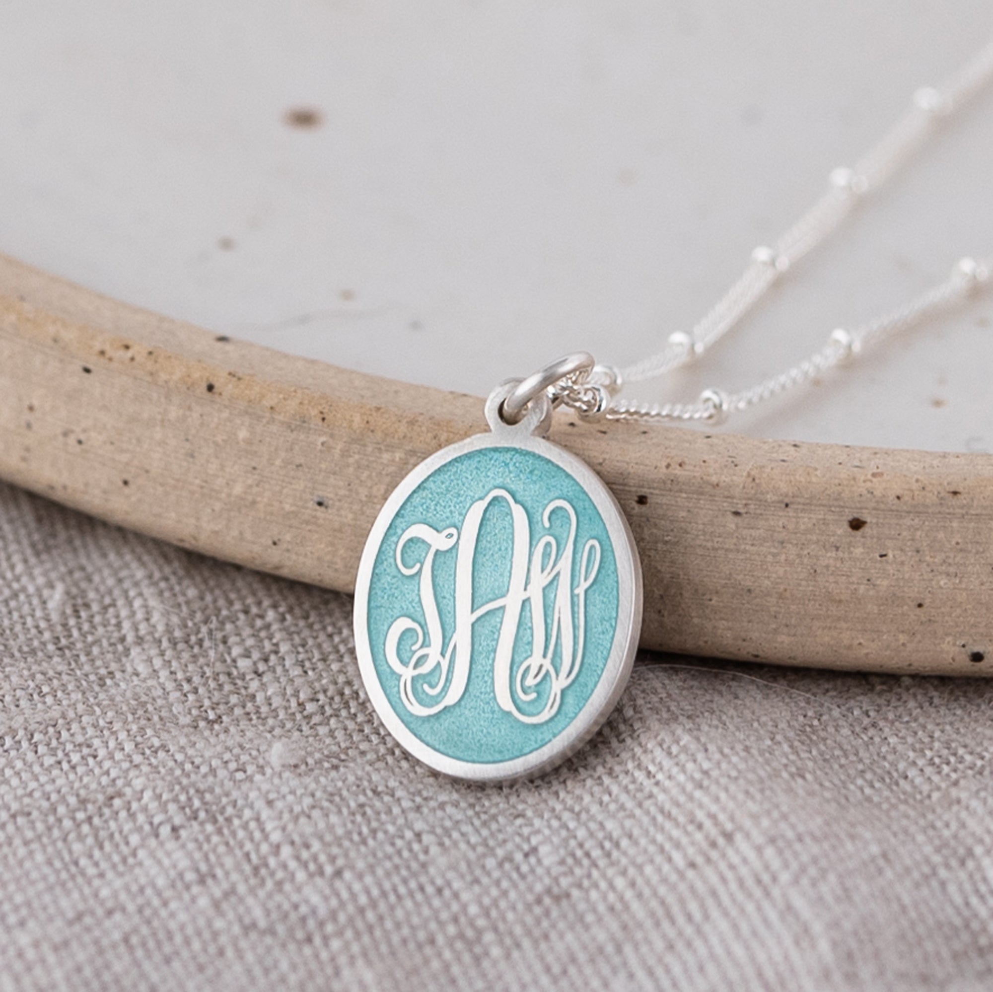 Three Initial Monogram Aquamarine Enamel Pendant Necklace on Linen