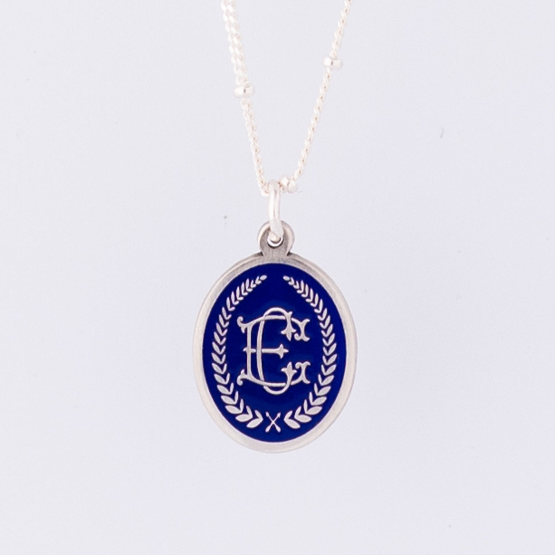 Silver Pendant Necklace with Entwined Monogram Initials on Blue Enamel