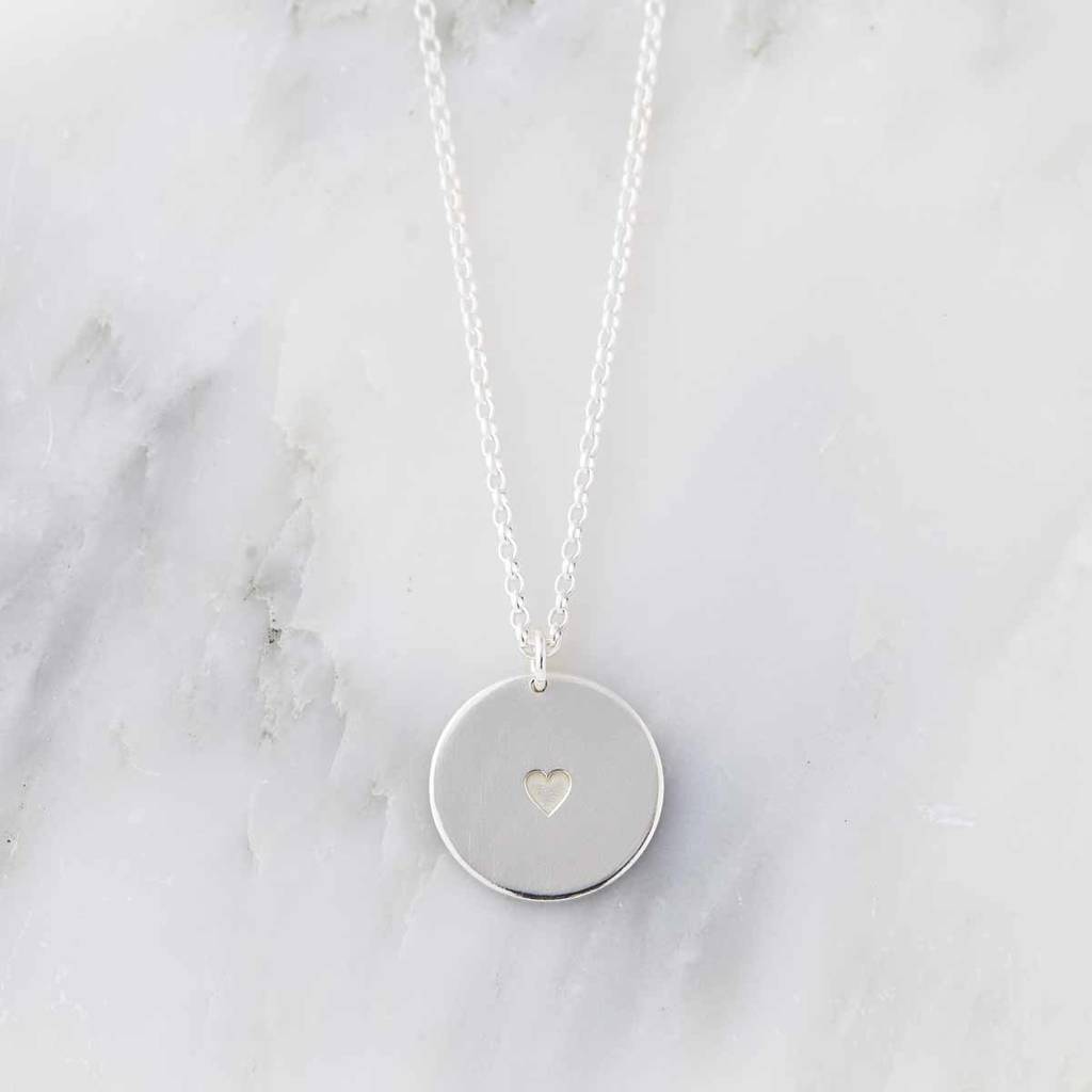 Sally round with a rose silver pendant necklace