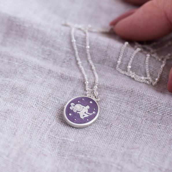 Silver and Lilac Enamel Zodiac Star Sign Pendant Necklace on Linen with hand